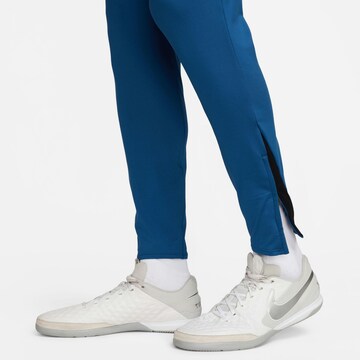 NIKE Slim fit Sports trousers in Blue