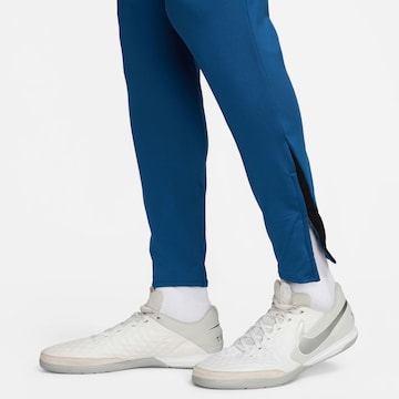 NIKE Slim fit Workout Pants in Blue