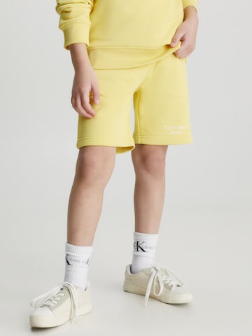 Calvin Klein Jeans Regularen Hlače | rumena barva: sprednja stran