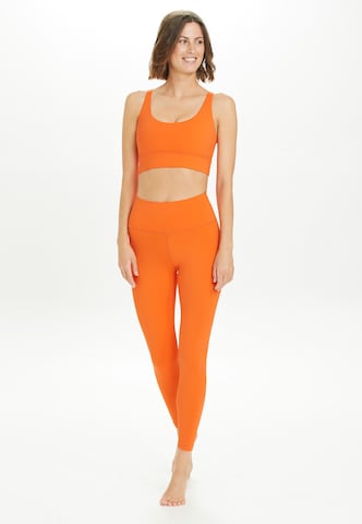 Athlecia Medium Support Sports Bra 'Gaby' in Orange