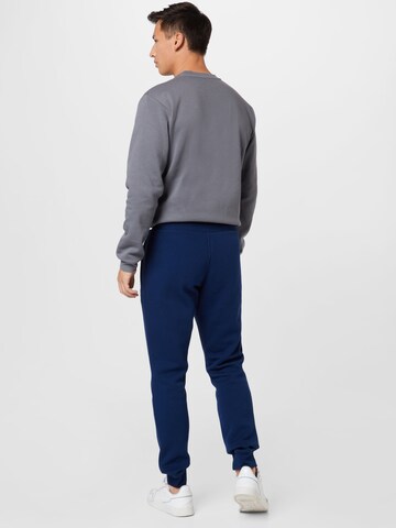 ADIDAS ORIGINALS Tapered Broek 'Adicolor Essentials Trefoil' in Blauw