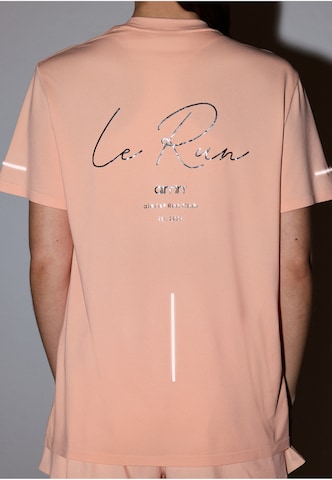 Aim'n Performance Shirt 'Le Run' in Orange