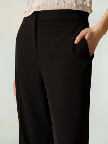 oltre Baggy Trousers in Black