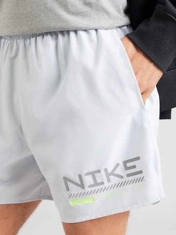 NIKE Обычный Спортивные штаны 'WNTRZ CHLNGR' в Серый