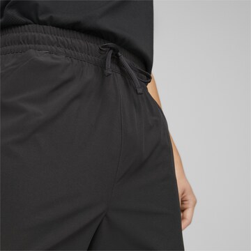 Regular Pantaloni sport 'Fit 7' de la PUMA pe negru