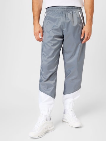 Nike Sportswear Tapered Trousers in Grey: front