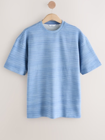 Tricou de la Next pe bej