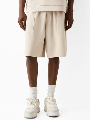 Bershka Regular Pants in Beige: front