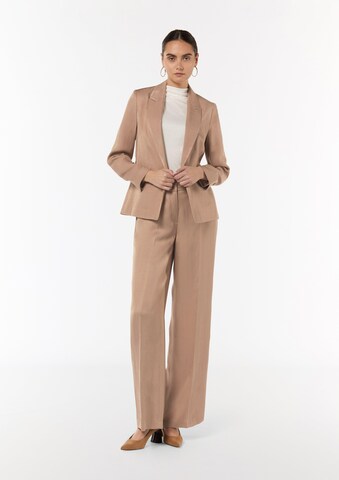 Wide leg Pantaloni con piega frontale di COMMA in marrone