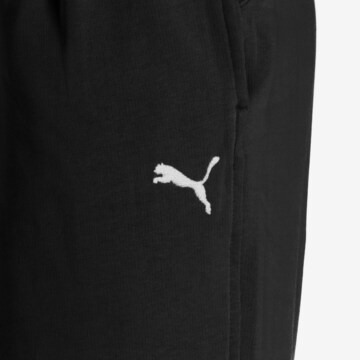 PUMA Zúžený Sportovní kalhoty 'Her' – černá