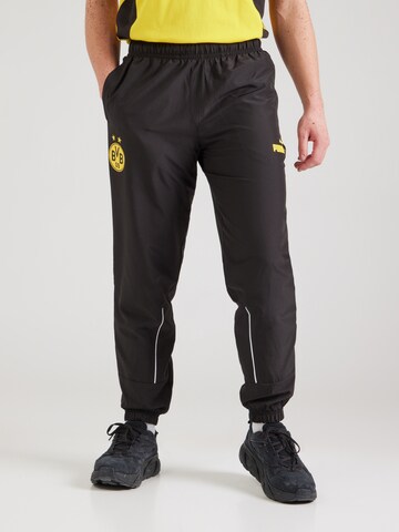 PUMA - Tapered Pantalón deportivo 'Borussia Dortmund FtblArchive' en negro: frente
