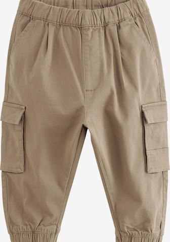 Next Tapered Trousers in Brown: front