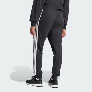 ADIDAS SPORTSWEAR Tapered Sports trousers 'Essential' in Black