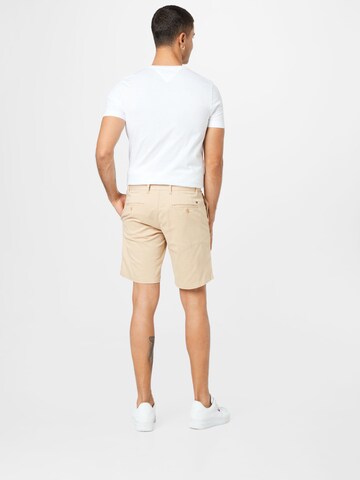 smėlio TOMMY HILFIGER Standartinis „Chino“ stiliaus kelnės 'Brooklyn 1985'