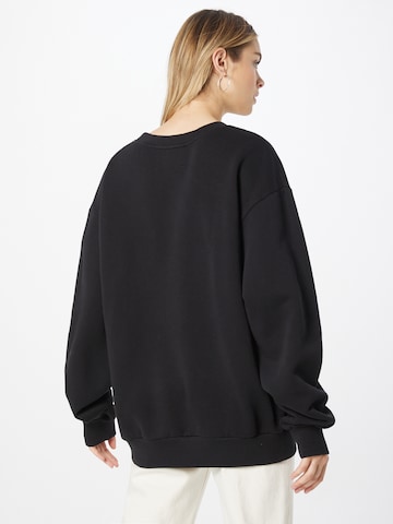 RAIINE Sweatshirt 'CHASE' in Schwarz
