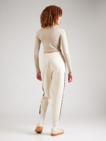 Effilé Pantalon de sport 'Essentials' PUMA en blanc