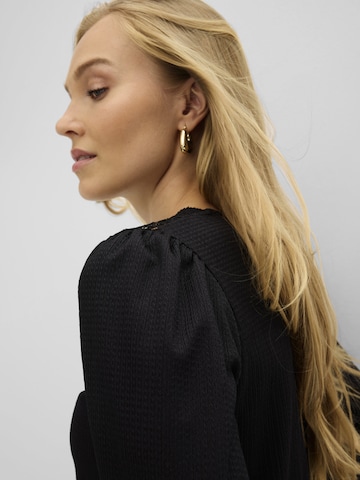 bonprix - Blusa en negro