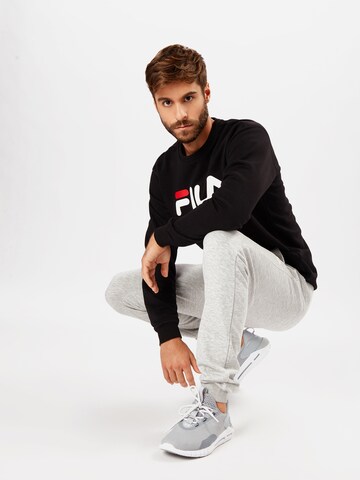 FILA Tapered Housut värissä harmaa