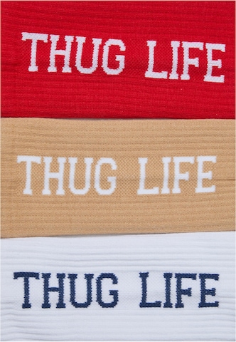 Karl Kani Sukat 'Thug Life' värissä beige