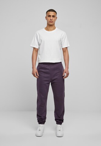 Tapered Pantaloni di Urban Classics in lilla