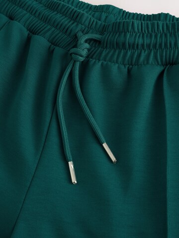 Next Широки крачоли Функционален панталон в зелено