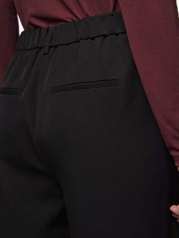 Wide leg Pantaloni 'Kamil' di PIECES in nero