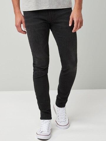 Skinny Jeans 'Motion Flex' di Next in nero: frontale