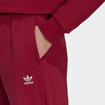 ADIDAS ORIGINALS Tapered Pants 'Adicolor Essentials Fleece' in Red