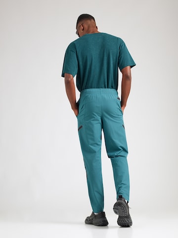 UNDER ARMOUR - regular Pantalón deportivo 'Unstoppable' en verde