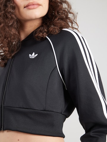 ADIDAS ORIGINALS Collegetakki 'SST' värissä musta