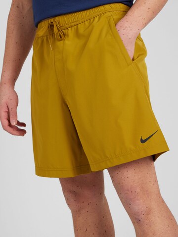 NIKE Regular Sports trousers in Orange