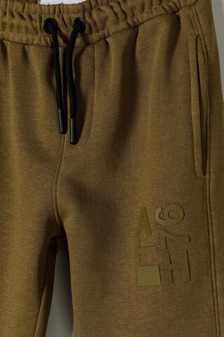 MINOTI Joggingpak in Bruin