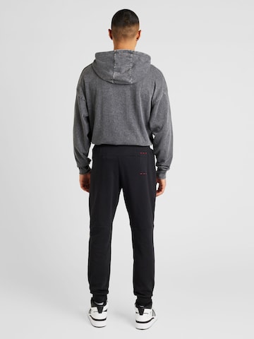 ADIDAS PERFORMANCE Tapered Sportbroek 'Manchester United Cultural Story' in Zwart