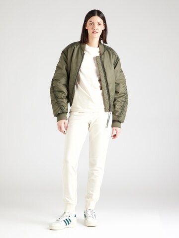 Maglietta di Champion Authentic Athletic Apparel in giallo