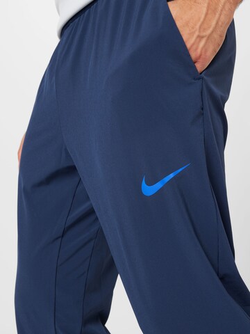 Regular Pantalon de sport NIKE en bleu