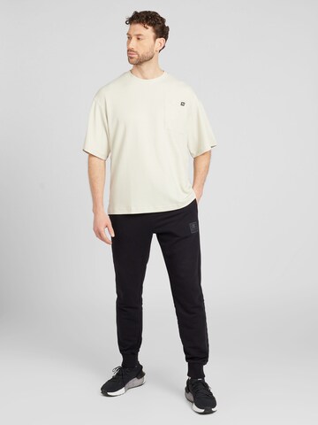 Champion Authentic Athletic Apparel Tapered Byxa i svart