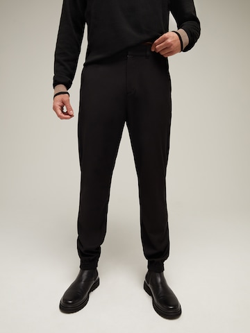 ABOUT YOU x Kevin Trapp Slim fit Chino Pants 'Fabian' in Black: front