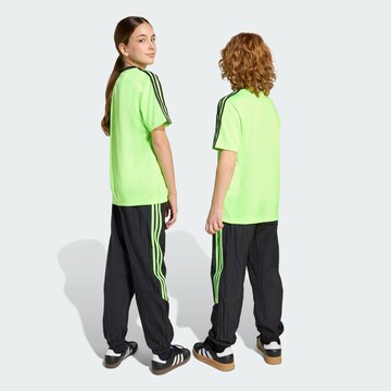 ADIDAS ORIGINALS Loose fit Trousers 'Teamgeist' in Black