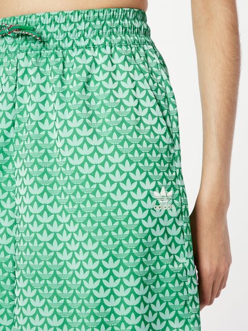 ADIDAS ORIGINALS Wide leg Pants 'Adicolor 70S Satin' in Green