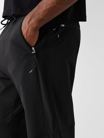 Bershka Tapered Pants in Black