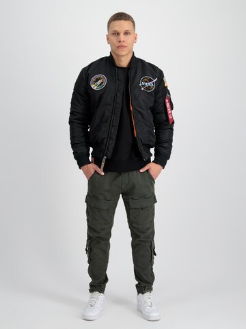 ALPHA INDUSTRIES Övergångsjacka 'NASA' i svart