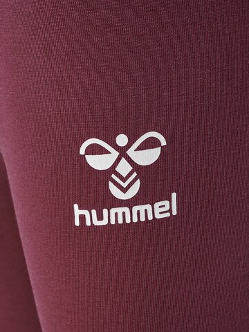 Hummel Skinny Spodnie sportowe 'Onze' w kolorze fioletowy
