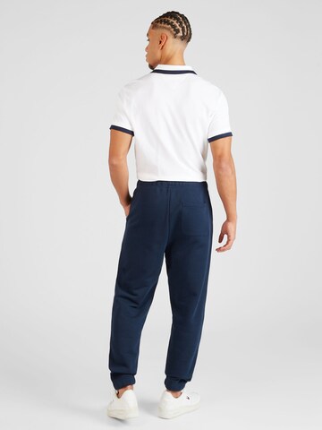 Tommy Jeans Tapered Byxa i blå