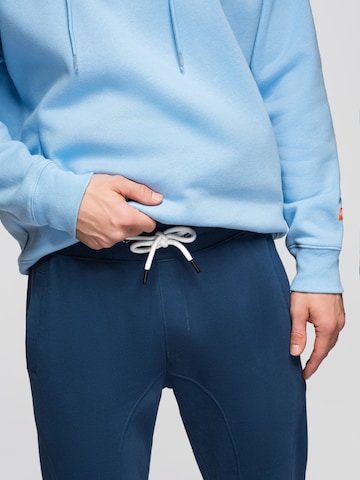 Effilé Pantalon de sport Ombre en bleu