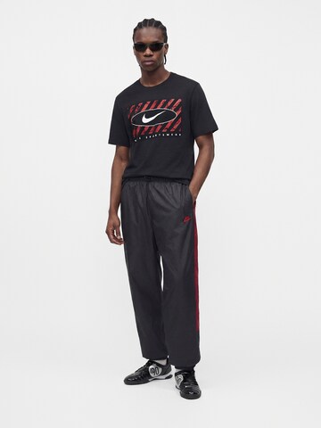 Nike Sportswear - Camisa em preto