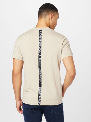 Calvin Klein Jeans Tričko – béžová: přední strana