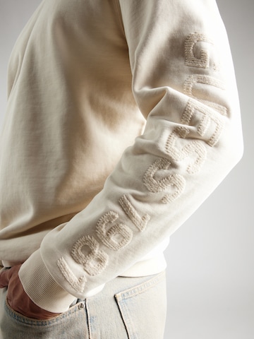 GUESS Collegepaita värissä beige