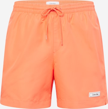 Calvin Klein Swimwear Board Shorts in Pink: front