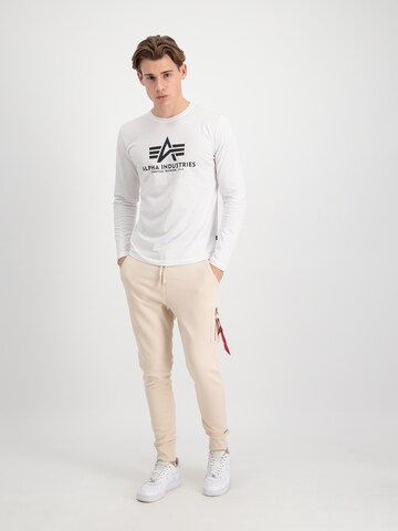 ALPHA INDUSTRIES Tapered Hose 'X-Fit' in Beige