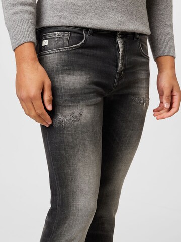 Skinny Jean Goldgarn en gris